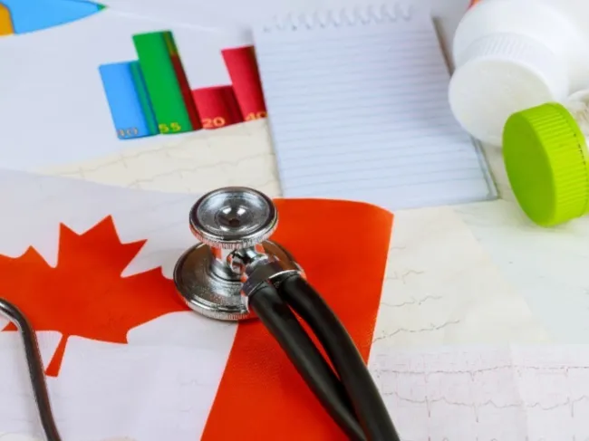 canada flag with stethoscope